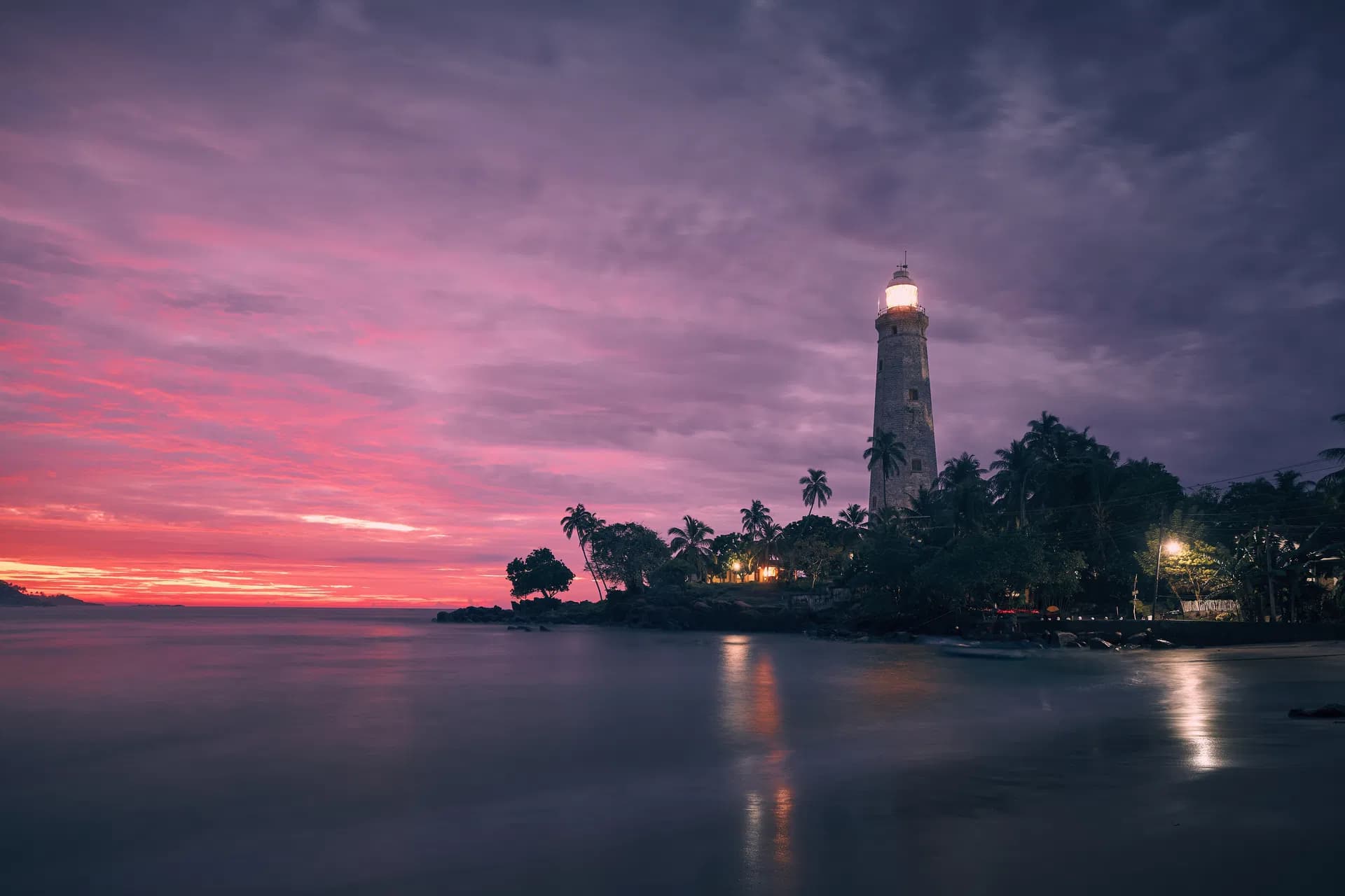 Lighthouse at colorful sunrise in Galle
